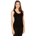 A woman wearing a lightweight black Merino wool tank top, highlighting the minimalist sporty design.