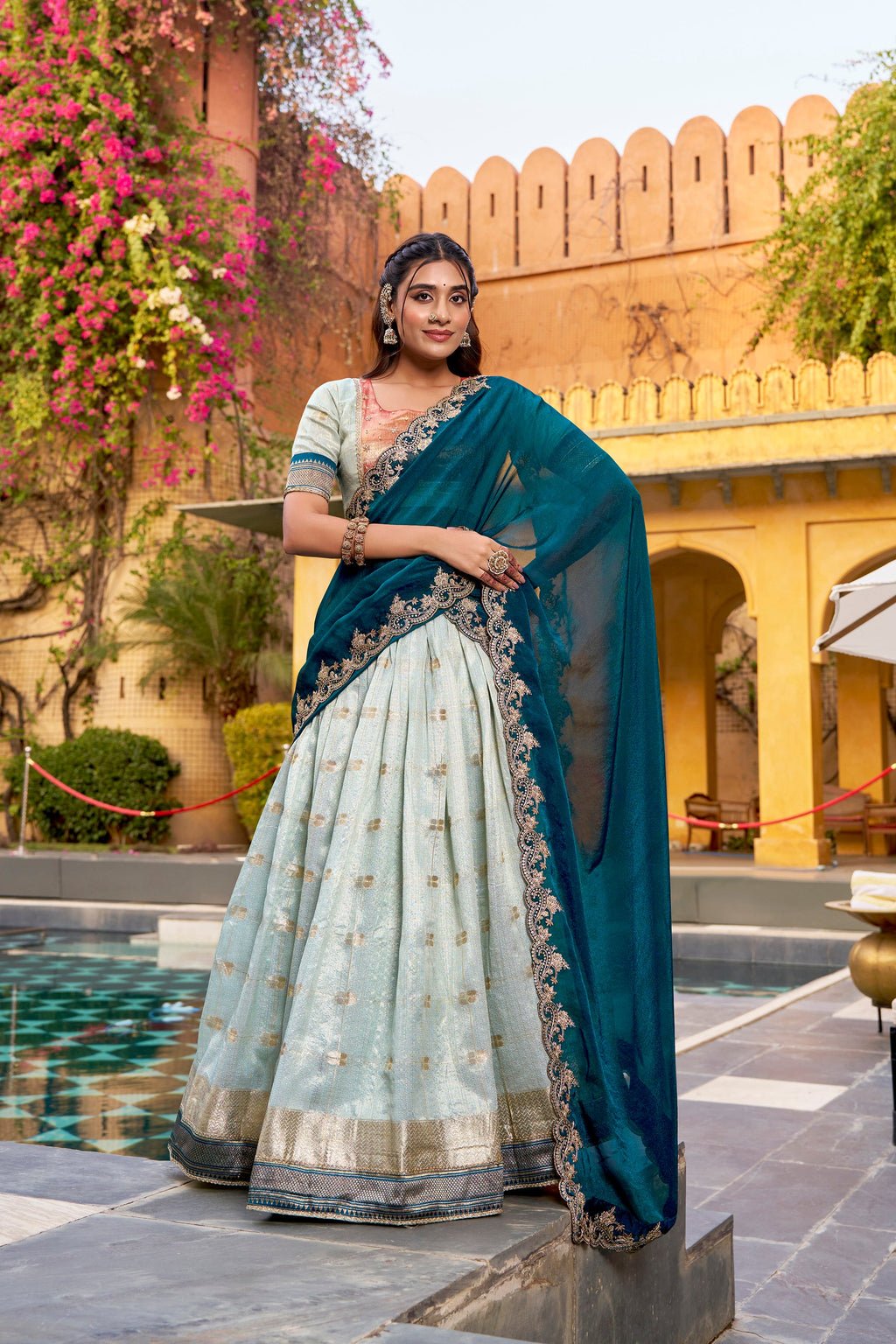 Skyblue Slub Kota lehenga choli with ornate Zari weaving and a traditional Paithani Jacquard border.