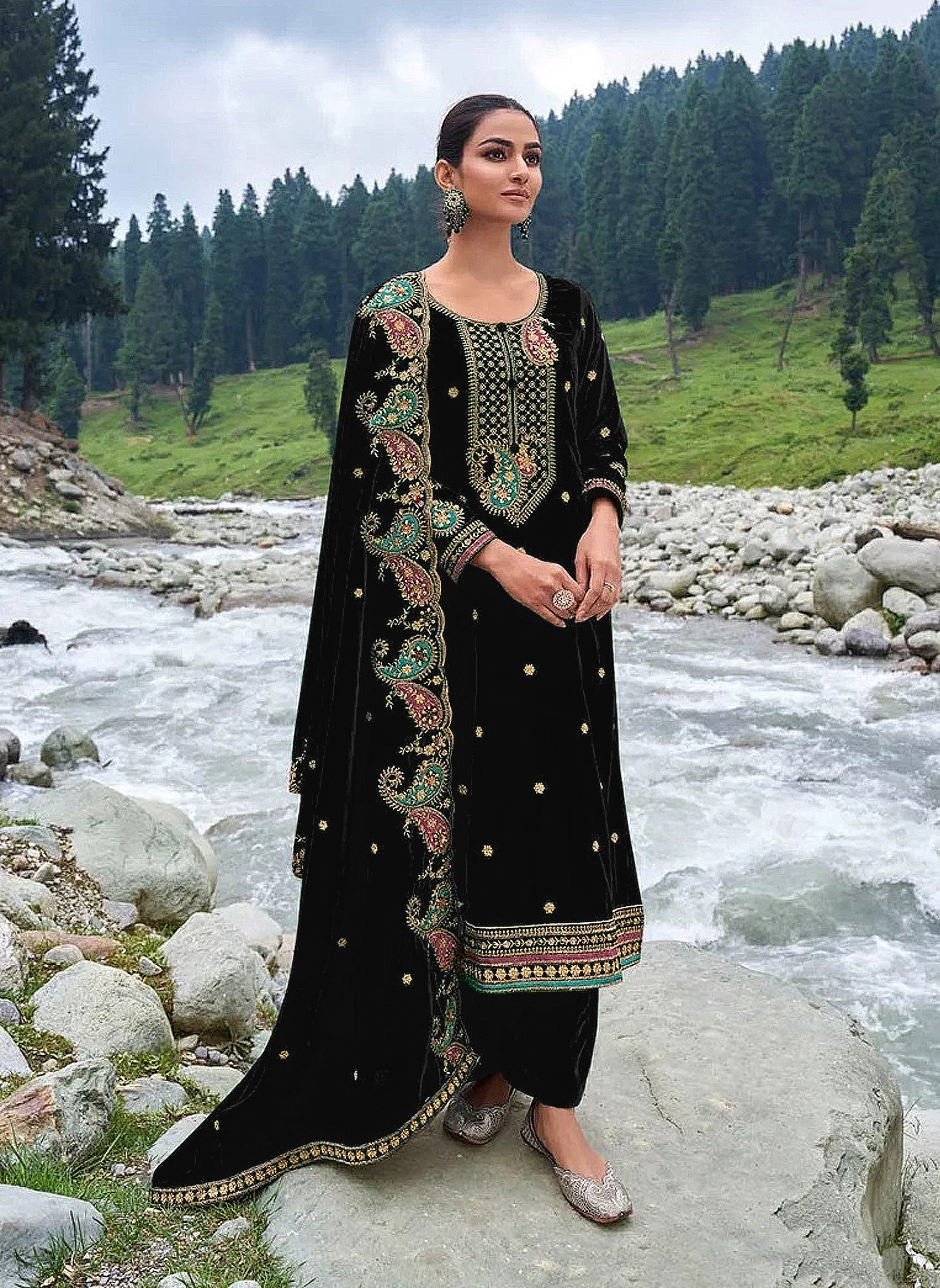 Close up of black velvet salwar suit fabric with intricate embroidery and sequence detailing
