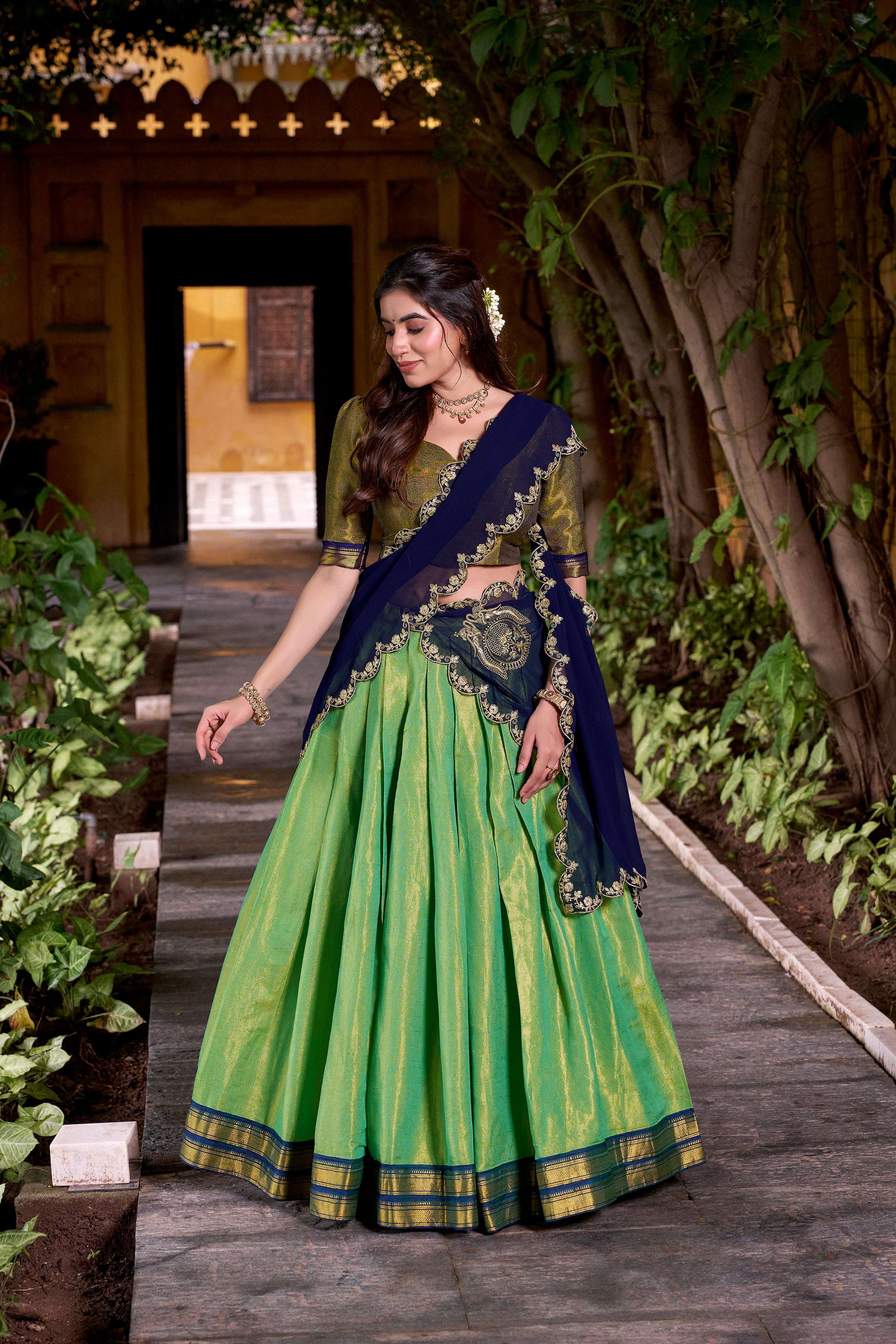 Seagreen and navy-blue Kanchipuram silk lehenga with gold Zari weaving