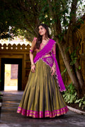 Olive green and magenta Kanchipuram silk lehenga choli with gold Zari weaving work and dupatta