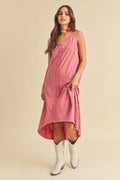 Woman wearing a stylish high-low hem midi tank dress with a classic scoop neckline