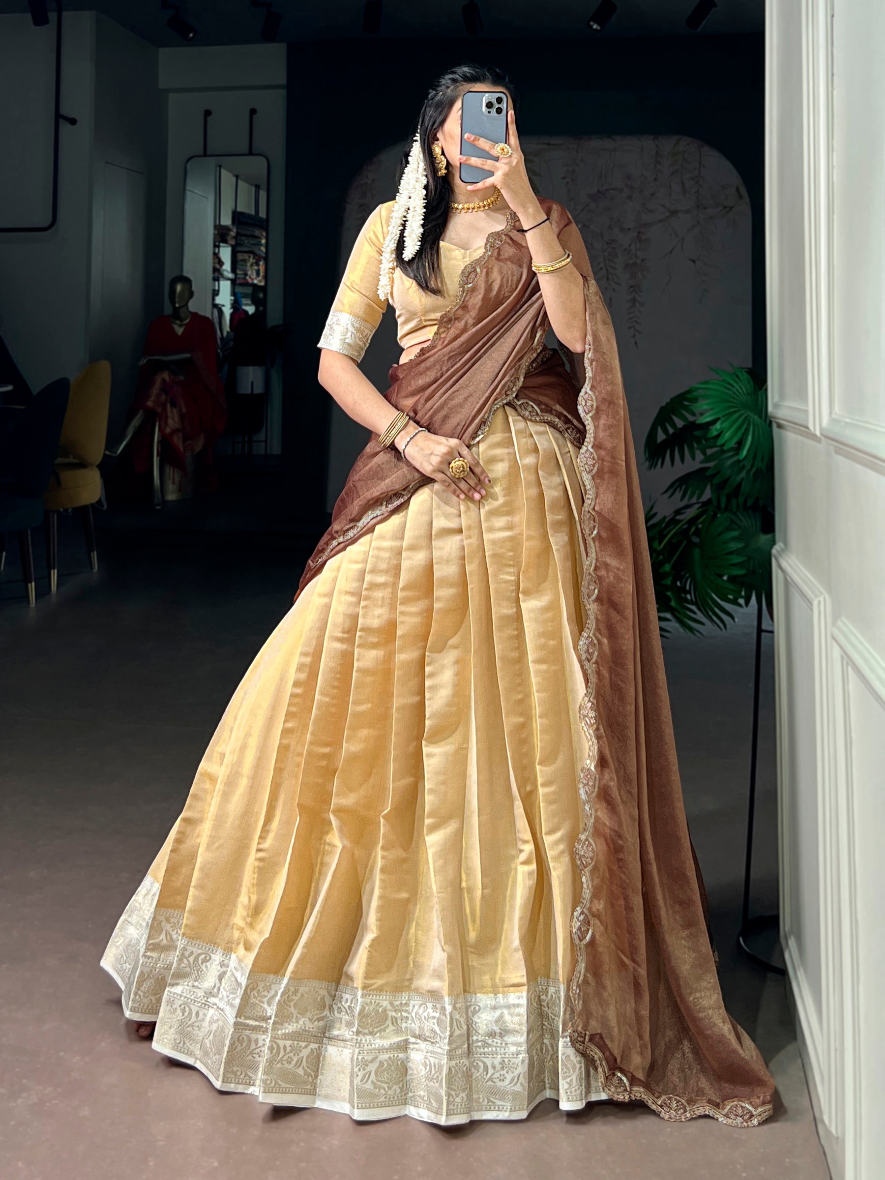 Cream Kanchipuram lehenga choli with detailed Zari weaving and drawstring waist.