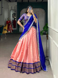 Elegant peach Kanchipuram lehenga choli featuring intricate zari weaving work and voluminous flair.