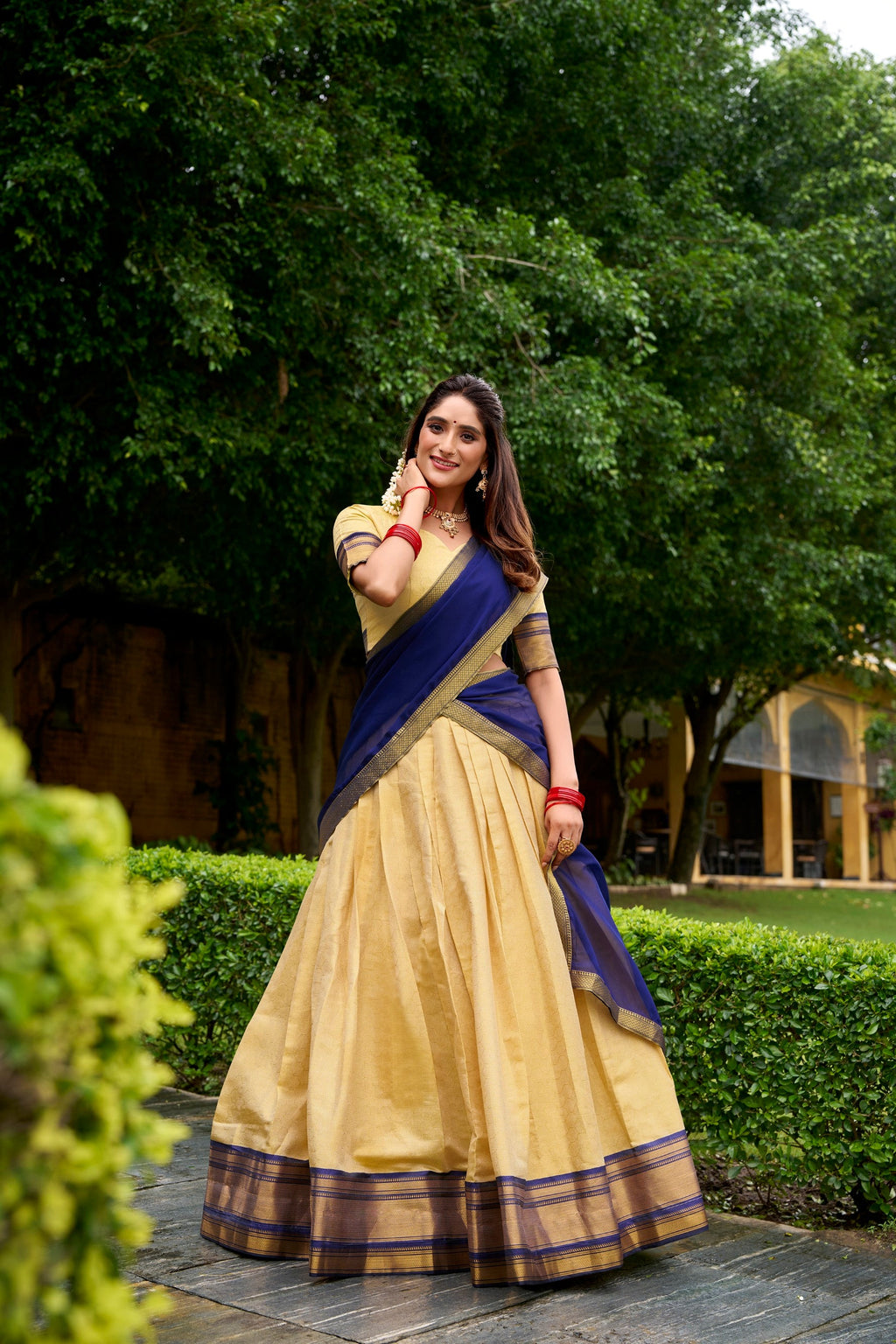 Cream Kanchipuram lehenga choli featuring elegant golden zari weaving