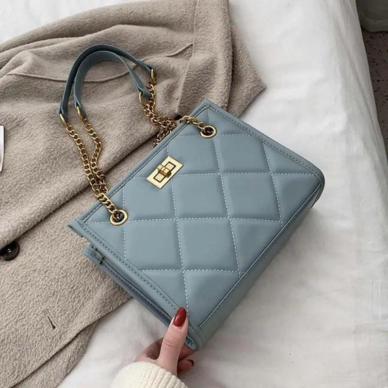 Trendy quilted geometric shoulder bag in blue PU leather