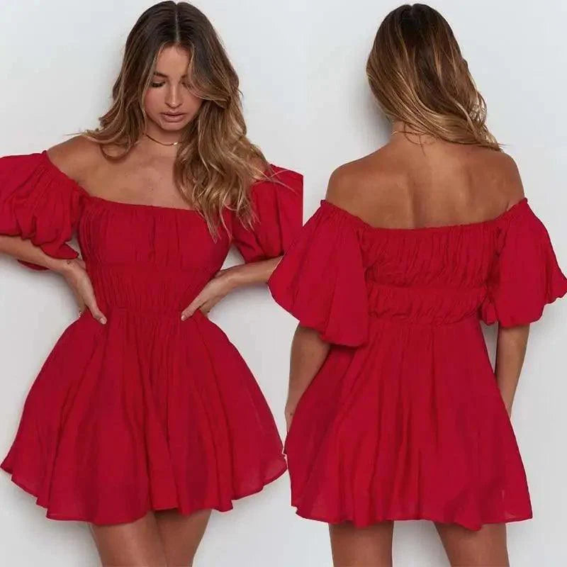 A woman wearing a solid color bohemian mini dress with short puff sleeves in red.