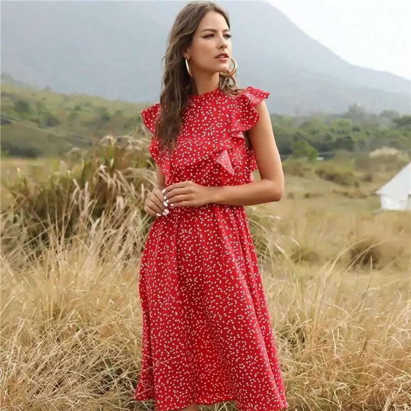 A romantic chiffon midi dress featuring butterfly sleeves and a polka dot pattern