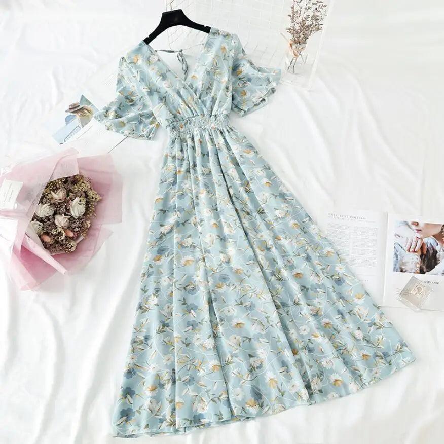 Woman wearing a floral print ruffled chiffon midi dress with a V-neck and high waist