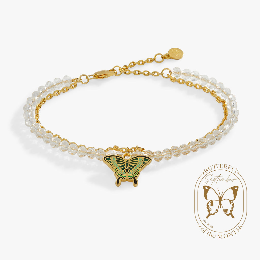 Emerald Swallowtail Butterfly charm bracelet with faceted clear glass beads and gold chain