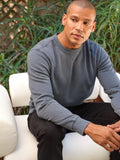 Model wearing a grey Mineral Wash Fleece Crew with visible mineral wash texture