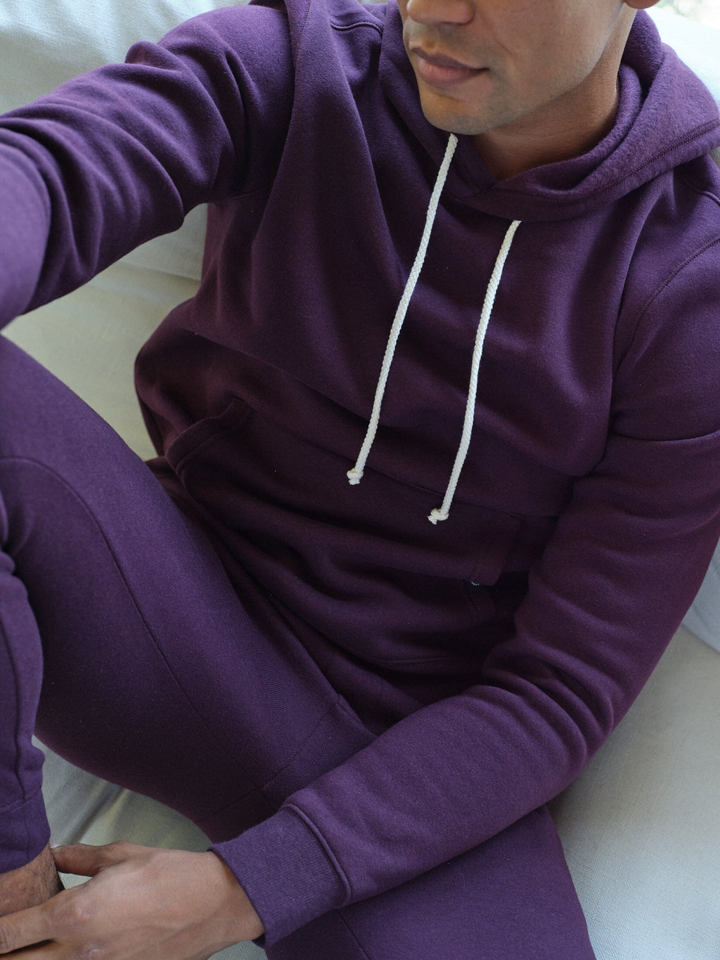 Men's dark purple triblend fleece pullover hoodie with front kangaroo pocket.