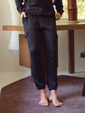 A pair of black Margot Feather Fleece Cargo Joggers featuring a relaxed fit, mid-rise, and side cargo pockets.
