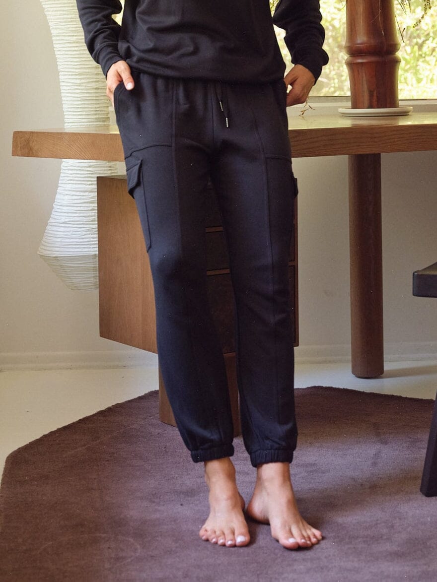 A pair of black Margot Feather Fleece Cargo Joggers featuring a relaxed fit, mid-rise, and side cargo pockets.
