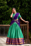 Green poly cotton lehenga choli with gold zari weaving work and dupatta