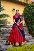 Red poly cotton lehenga choli set featuring intricate zari weaving and matching dupatta.