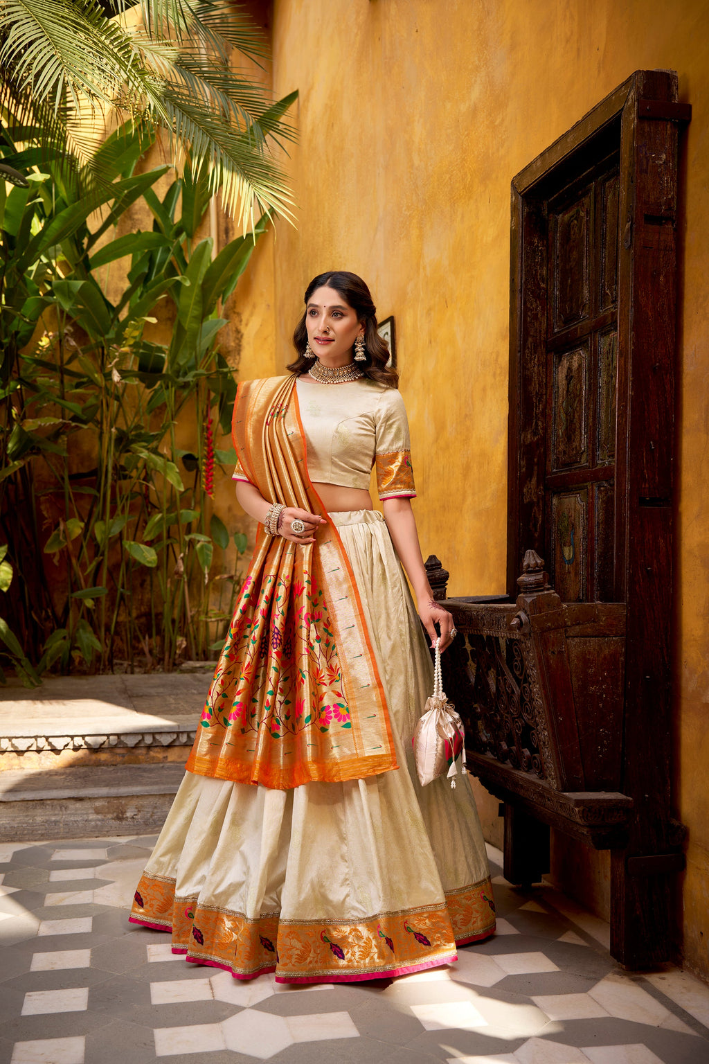 Off White Silk Paithani lehenga choli with Zari weaving and lace border detail