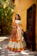 Off White Silk Paithani lehenga choli with Zari weaving and lace border detail