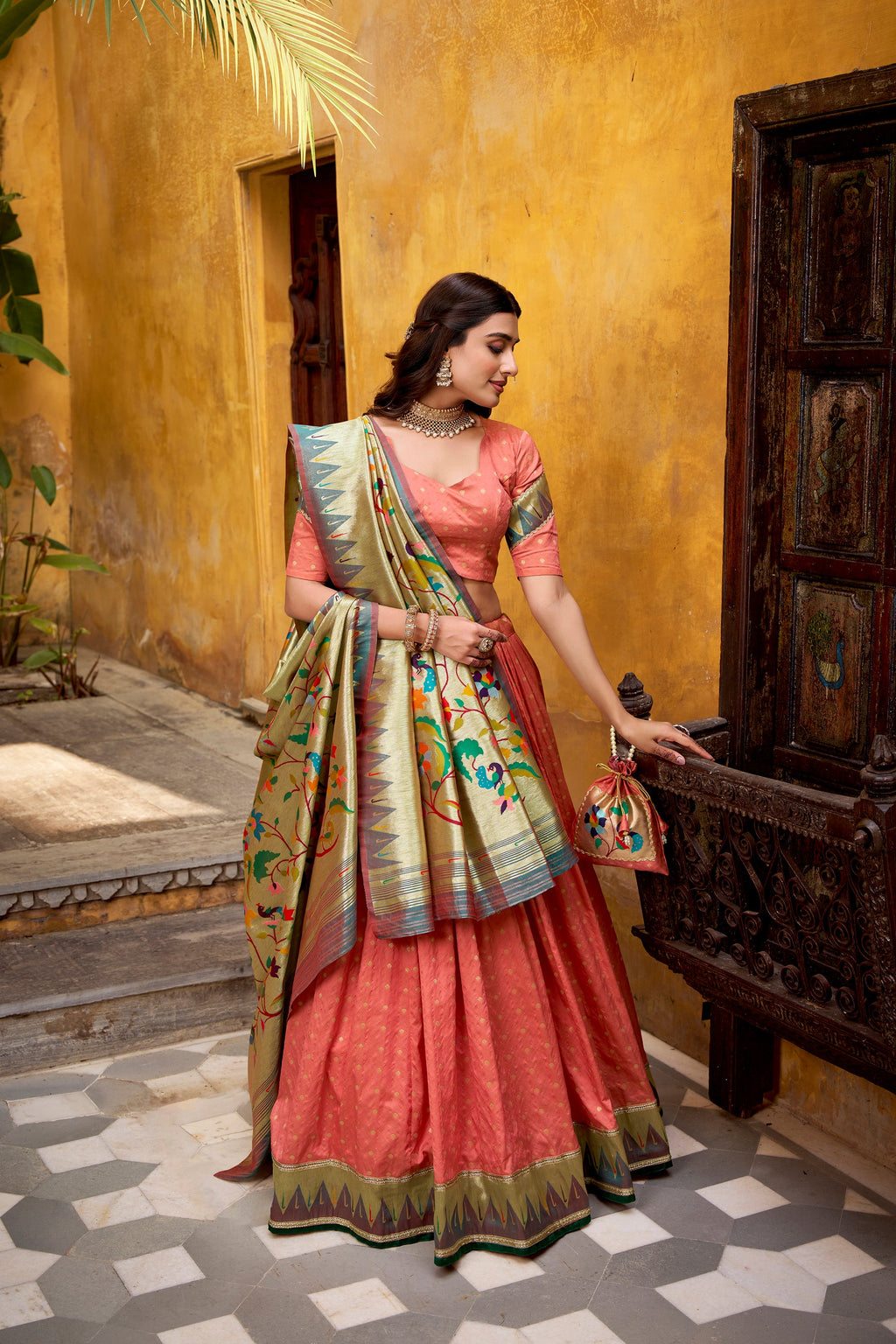 Peach Silk Paithani lehenga choli with zari embroidery and lace borders