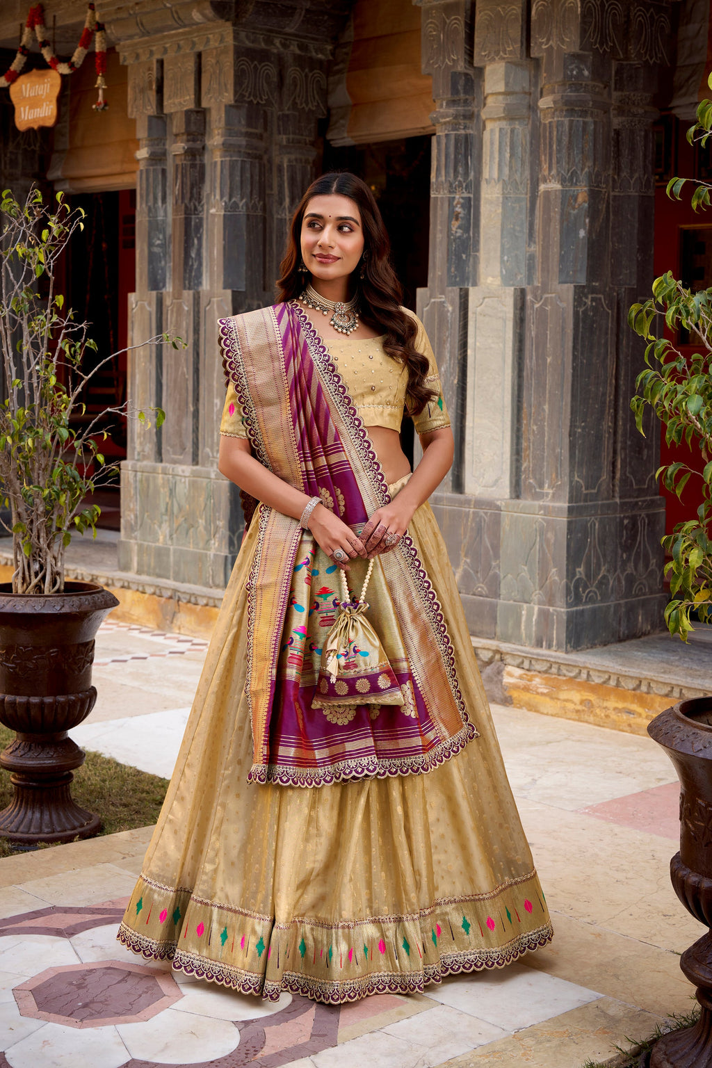 Cream Simmer Organza lehenga choli with intricate Zari weaving and lace border detailing