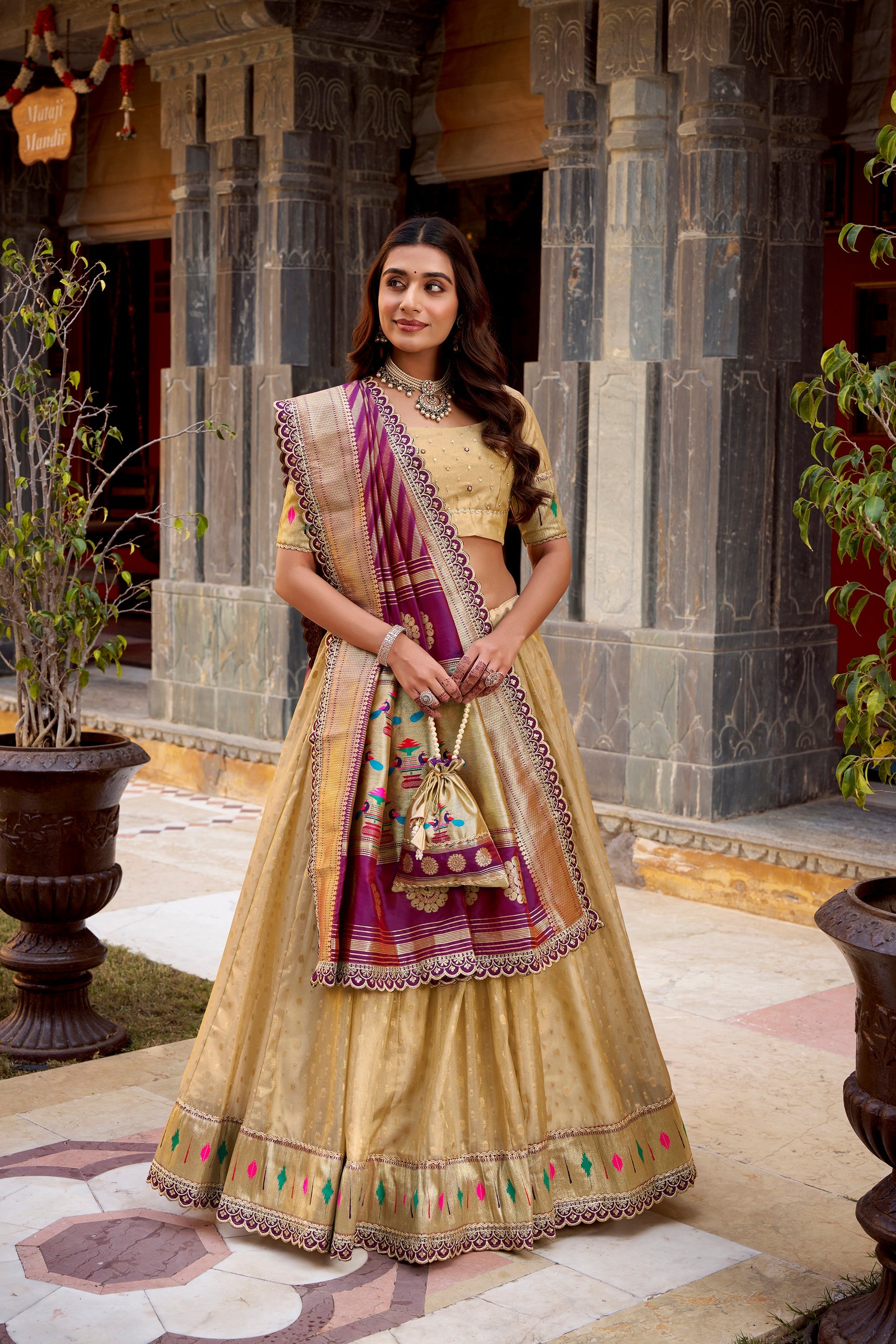 Cream Simmer Organza lehenga choli with intricate Zari weaving and lace border detailing