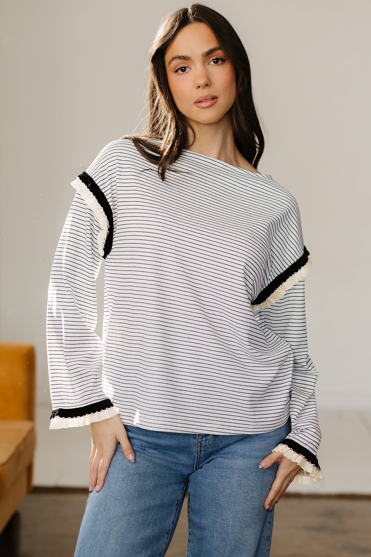 Women's Anya striped knit long sleeve top with ruffle trim in white and black