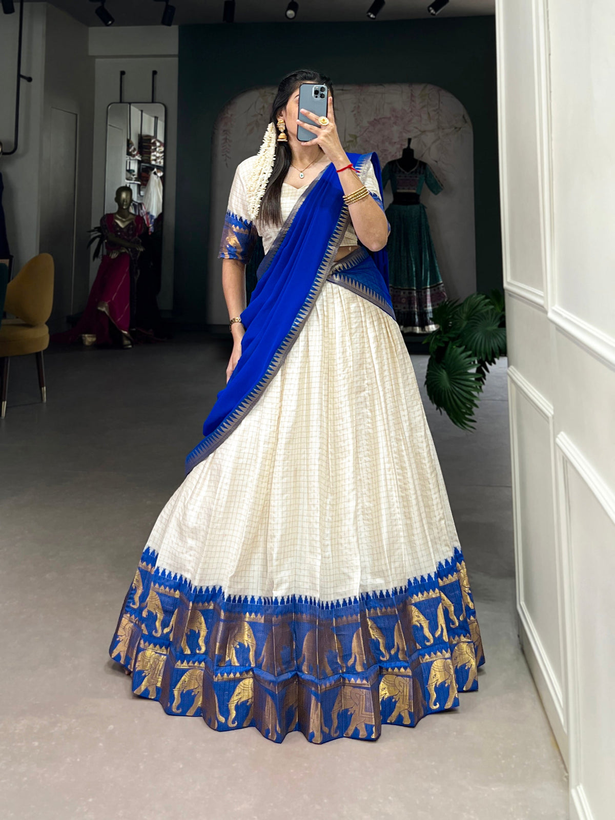 White poly-cotton lehenga choli with zari weaving and chex pattern, complete with matching dupatta.