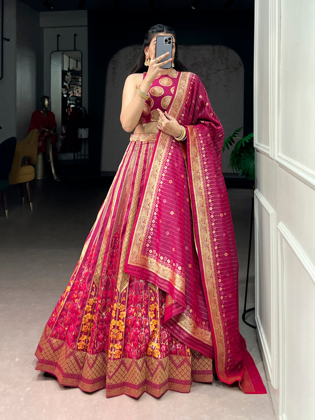 Pink silk lehenga choli with ornate zari weaving work and matching dupatta.