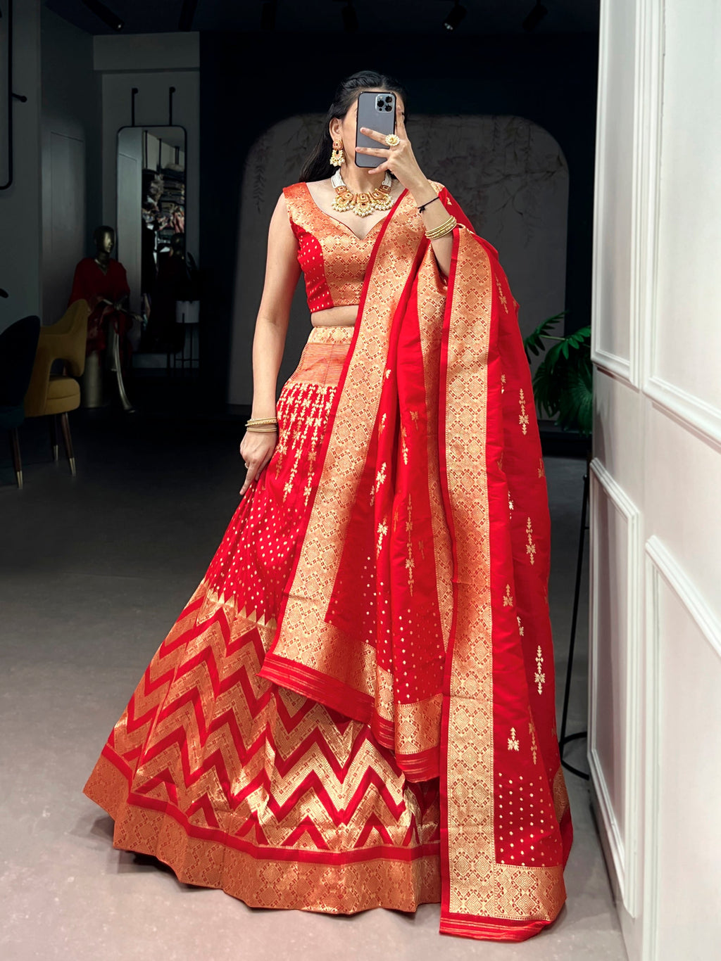 Red silk lehenga choli set with intricate zari weaving work and matching dupatta