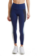 Women wearing navy and black high-rise color block leggings with side panels and 24-inch cropped inseam