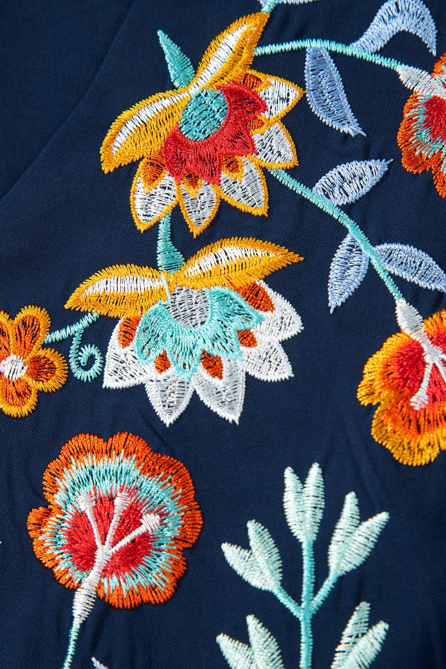 Embroidered Babydoll Blouse with Notched Neck and Ruffle Sleeves