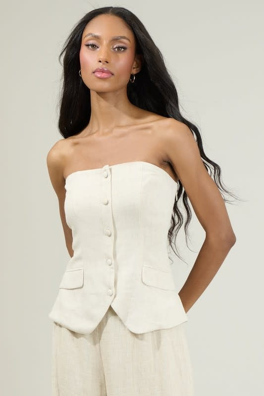 Model wearing Candida Strapless Button Up Top in Natural with front buttons and pockets