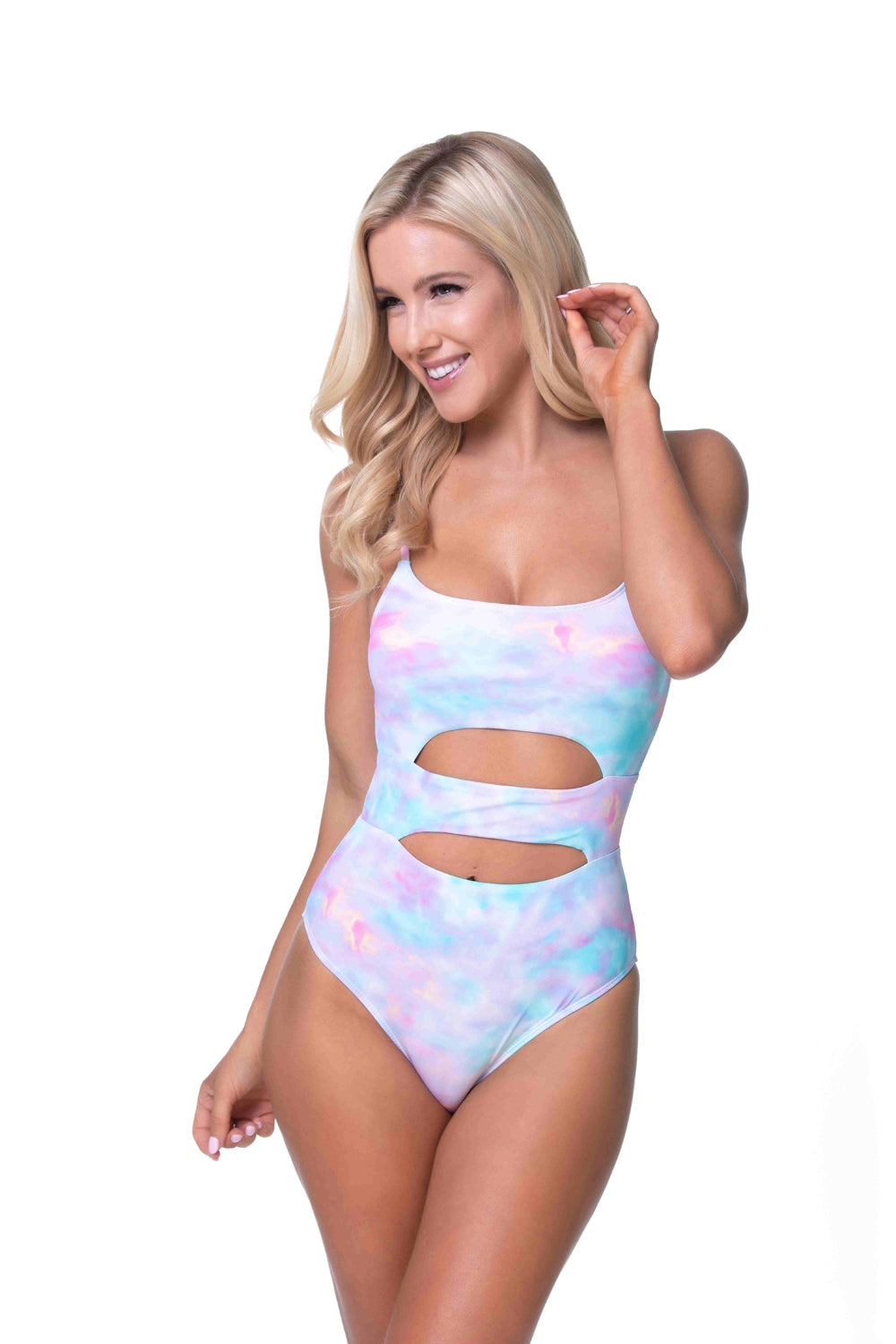 A stylish pink, blue, and white tie dye one piece swimsuit with modern cutout details.