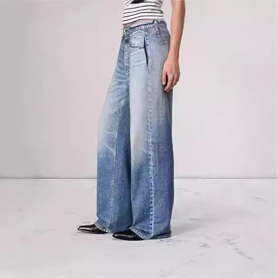 A model wearing Retro Mid Rise Wide Leg Loose Jeans in a faded blue denim wash, showcasing the relaxed fit and unique color transition.