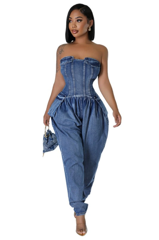 A stylish Women's Denim Jumpsuit by BY CLAUDE worn with a flattering, true-to-size utility fit.