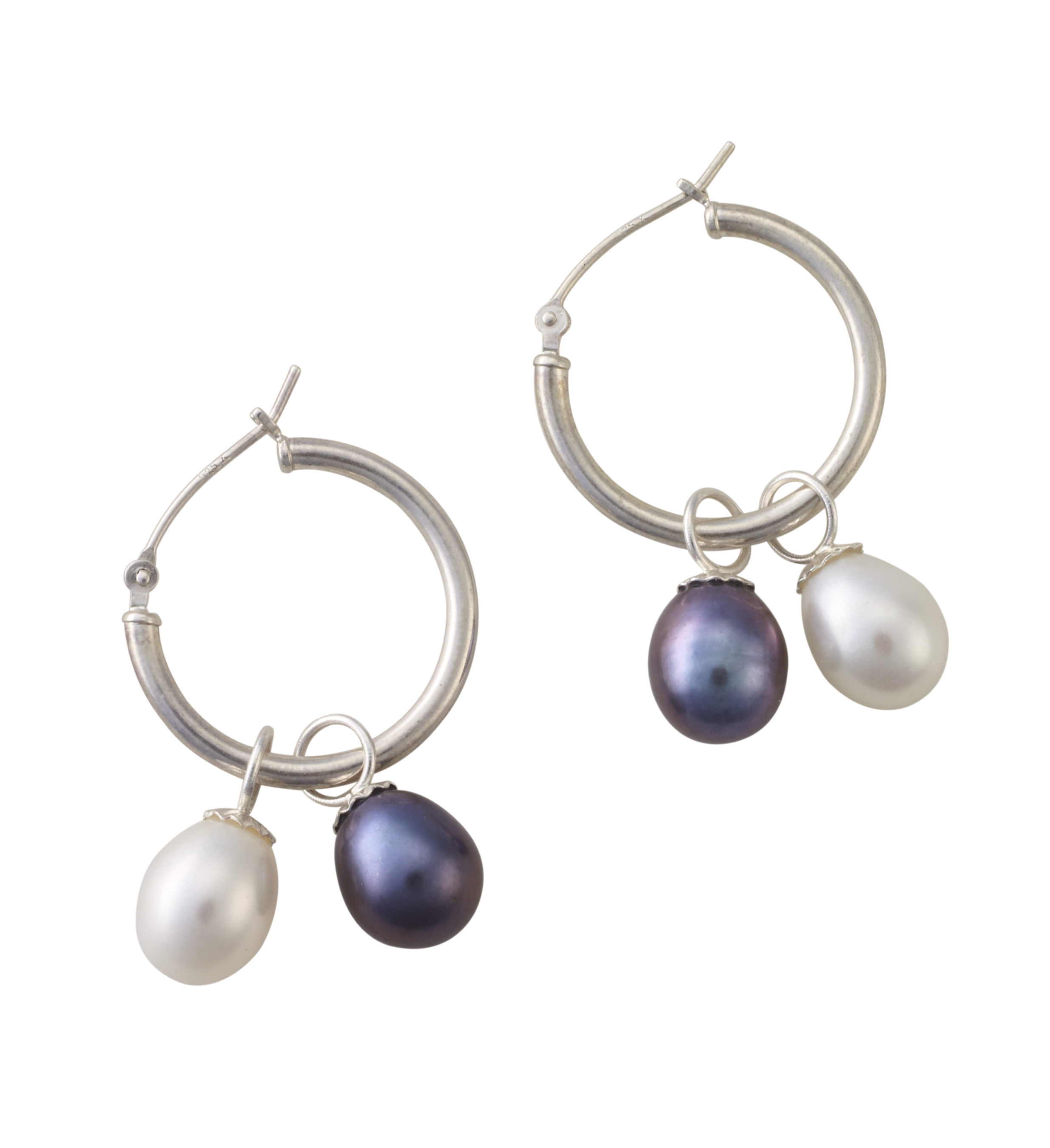 A pair of silver hoop earrings each holding one white freshwater pearl and one black freshwater pearl.