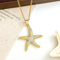 Gold starfish pendant necklace with pave-set cubic zirconia stones on a delicate cable chain