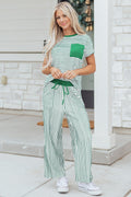 Woman wearing a kelly green and white striped short sleeve tee and matching relaxed fit pants set