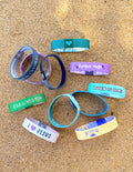 A colorful assortment of knit wristbands from the Elevated Faith mystery 50-pack