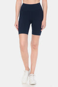 Model wearing navy blue high waist active shorts with a compression fit