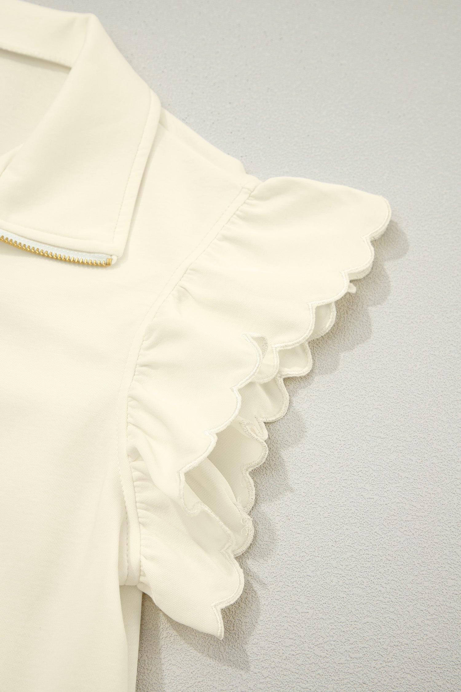 Juniper Ruffled Short Sleeve Blouse in Off-White and Cream