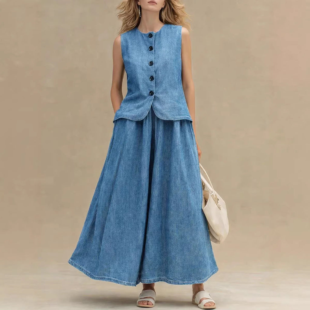Model wearing a blue denim sleeveless button-down vest and a matching A-line maxi skirt.