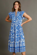 Blue and white abstract print midi dress with tiered silhouette and ruffle cap sleeves