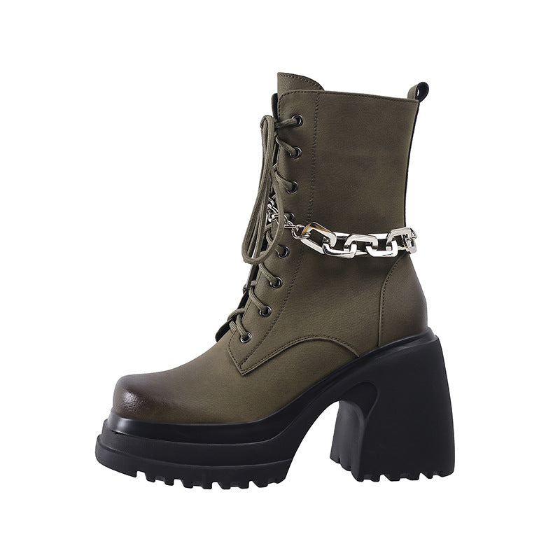 Pair of women's olive green leather chunky platform combat boots with lace-up front, high block heel, and silver-tone chain detail.