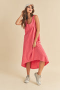 Model wearing a stylish midi tank dress with a high-low hem and scoop neckline