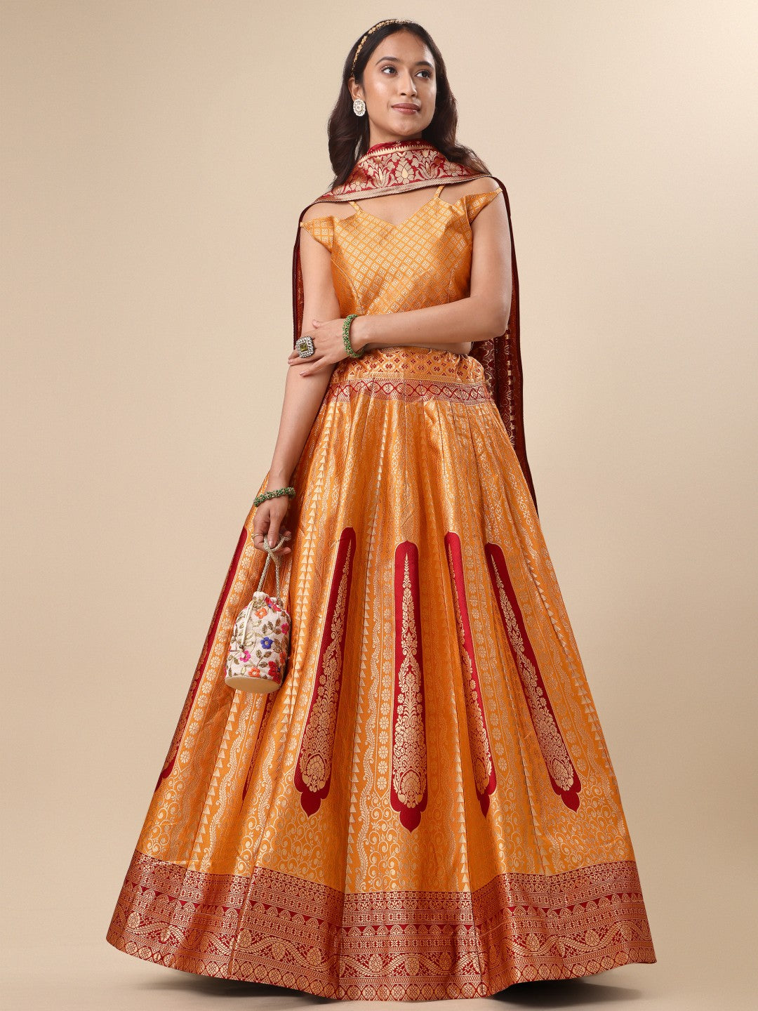 Orange ready-to-wear lehenga with wide flare and included blouse material