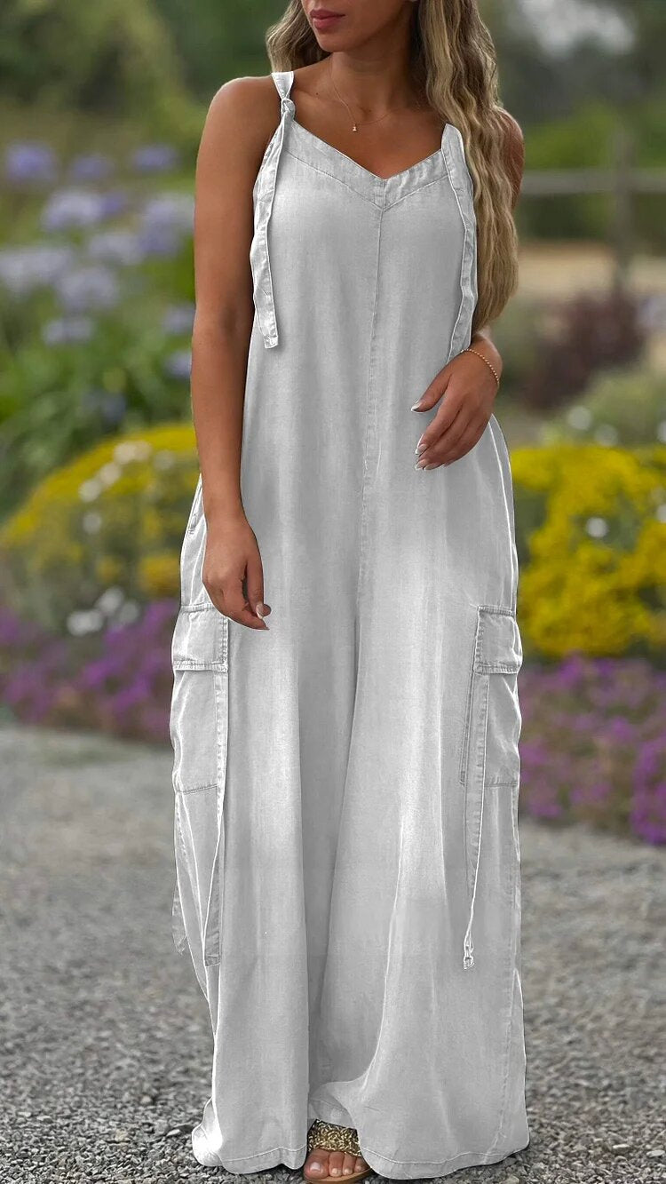 Woman wearing a relaxed-fit, washed charcoal grey cotton wide-leg jumpsuit with V-neckline