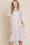Woman wearing a casual printed round neck tee dress with short sleeves and pockets