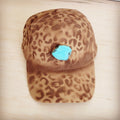 Tan suede baseball cap with hand-painted leopard print and a large turquoise stone accent.