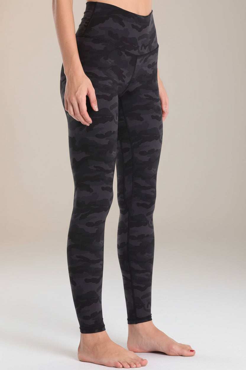 Close up of women wearing animal print high waist workout leggings.